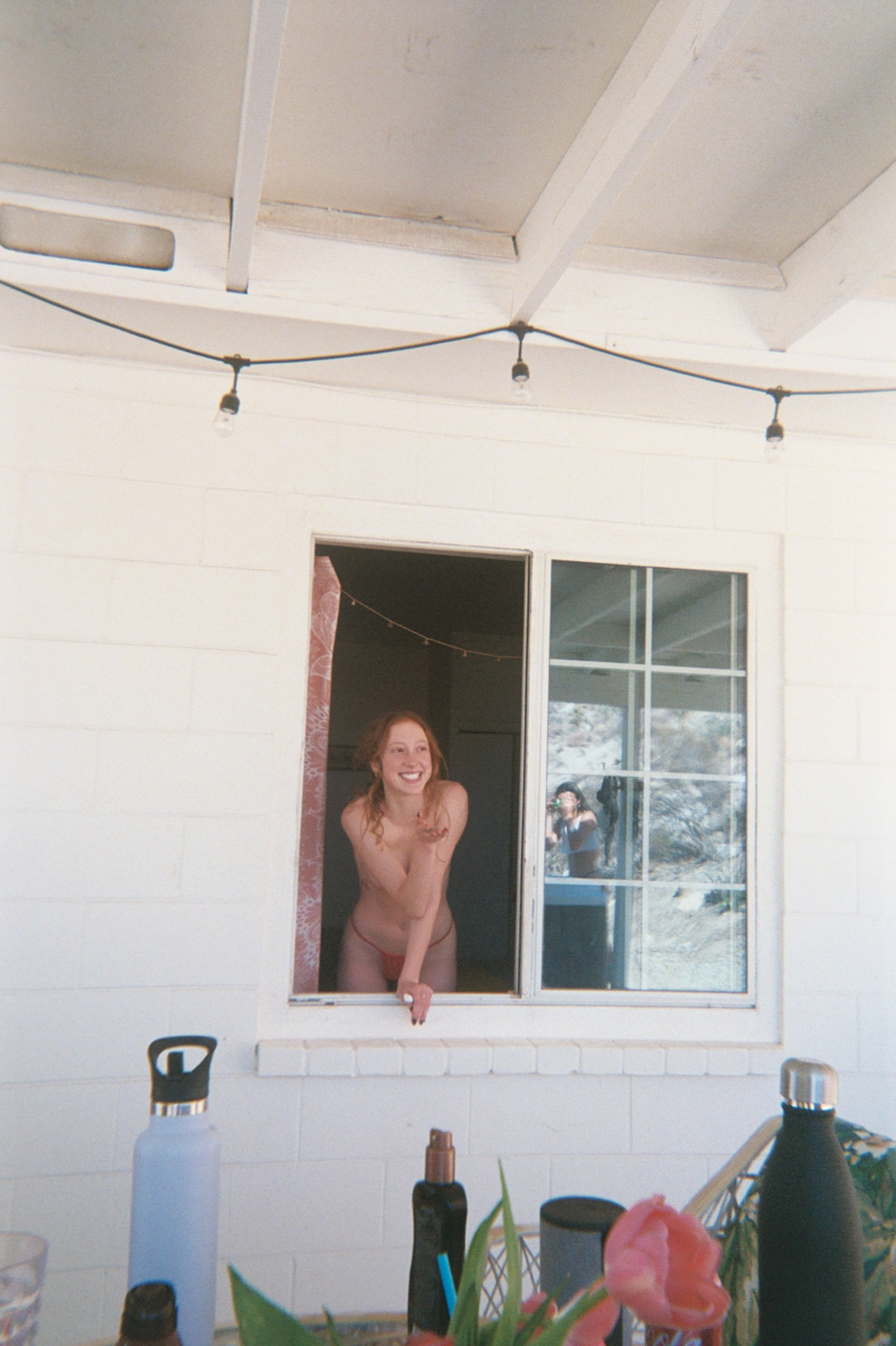 woman leaning out a window